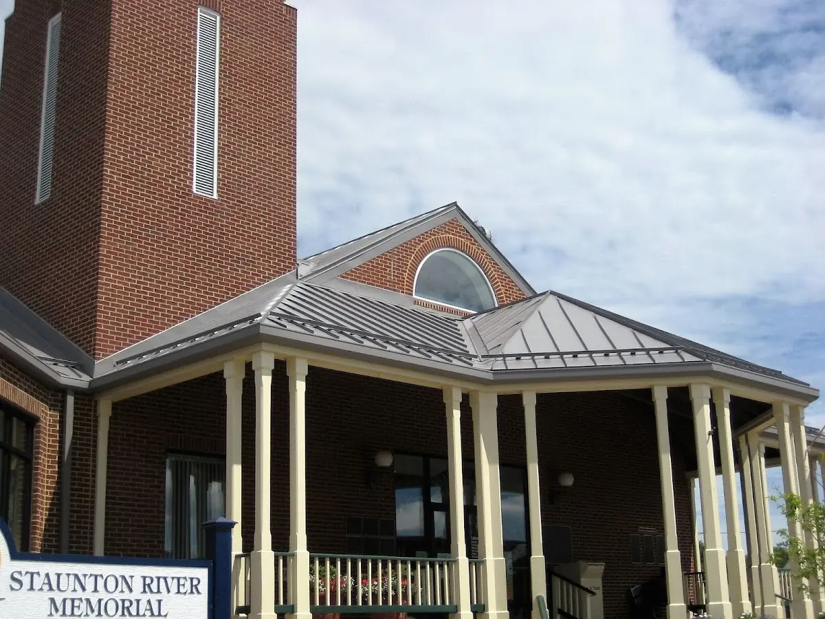 Skilled roofing craftsmen working on a residential roof in Cains Corners